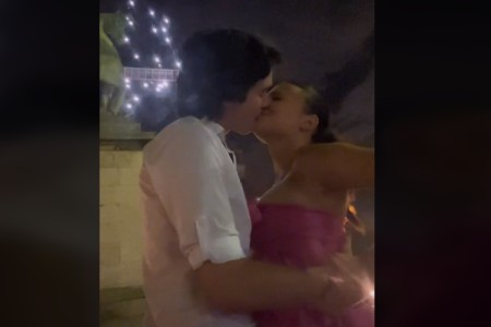 Ester kissing her beau
